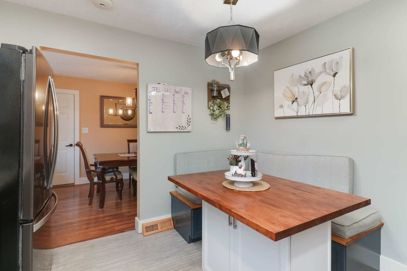 1222 Jersey Avenue Normal, IL 61761 - Photo 9 of 41 a view of a dining room with furniture and wooden floor