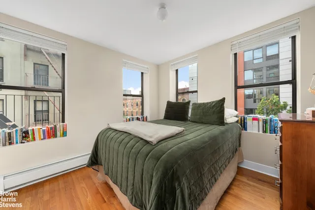 a kitchen with wooden cabinets and stainless steel appliances
