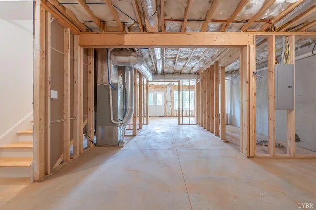 a view of a hallway with wooden walls