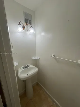 a bathroom with a sink toilet and vanity