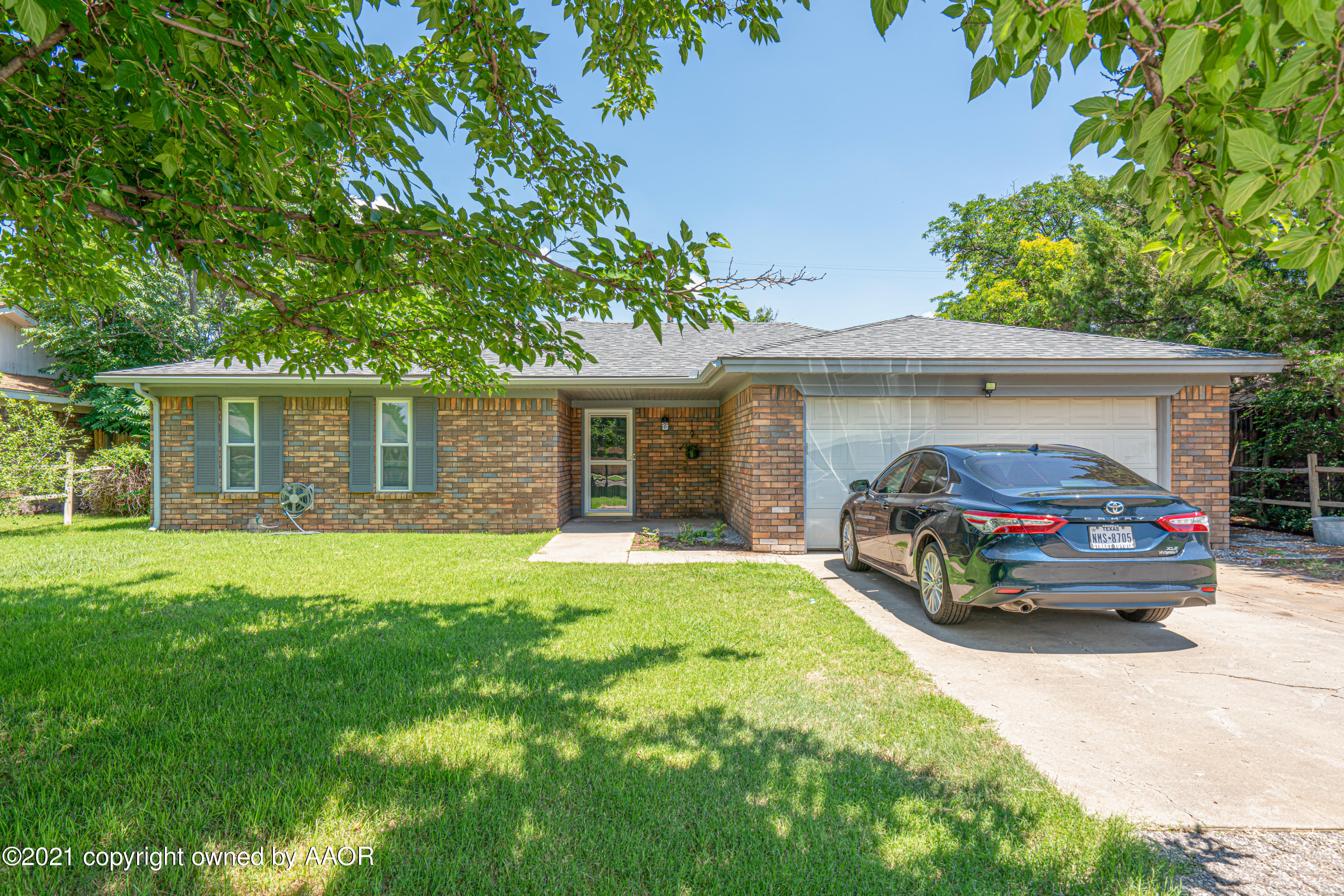 5308 Hillside Road Amarillo, TX 79109 - Photo 2 of 23 a car parked in front of a house