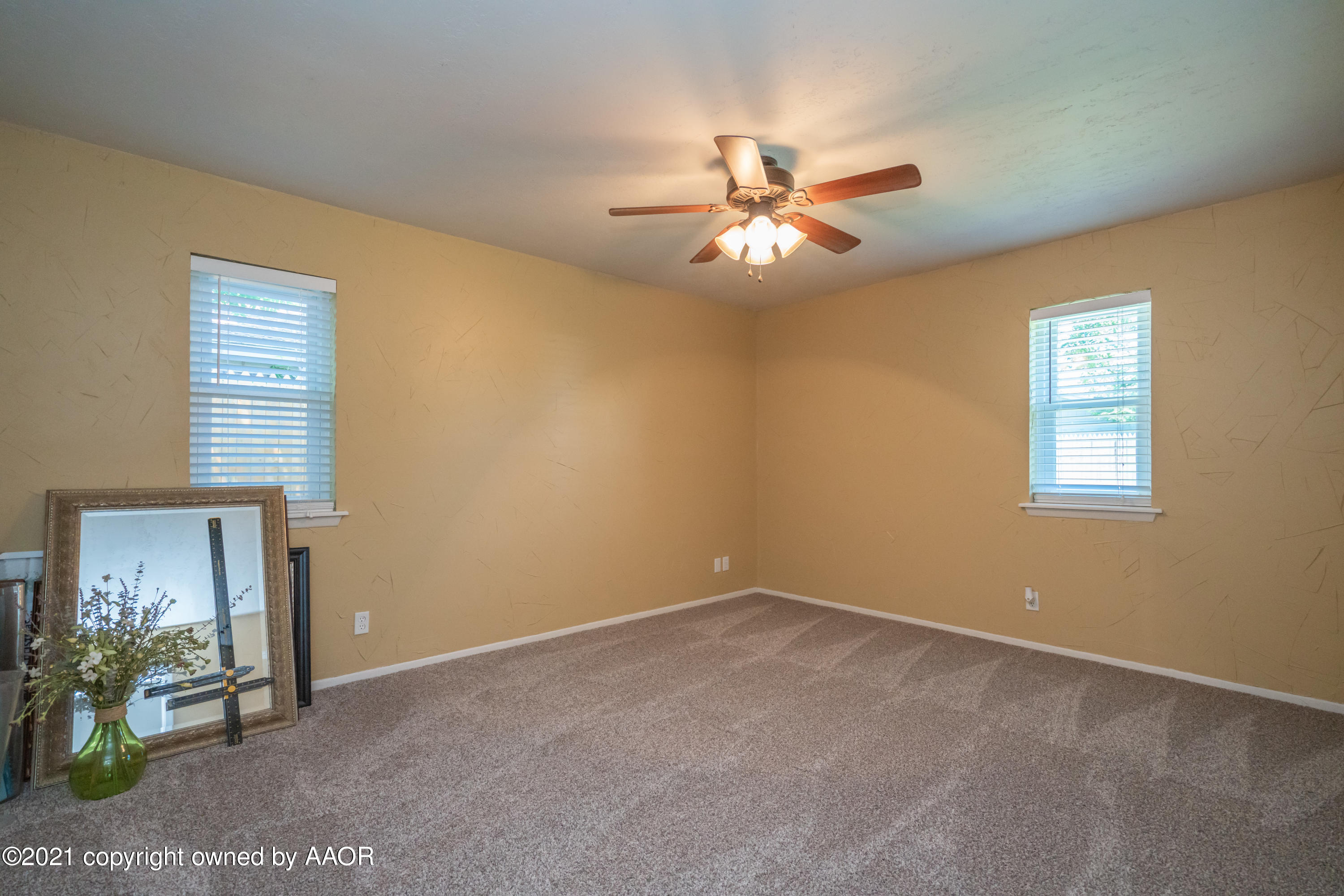 5308 Hillside Road Amarillo, TX 79109 - Photo 15 of 23 a view of a livingroom with a ceiling fan and a window
