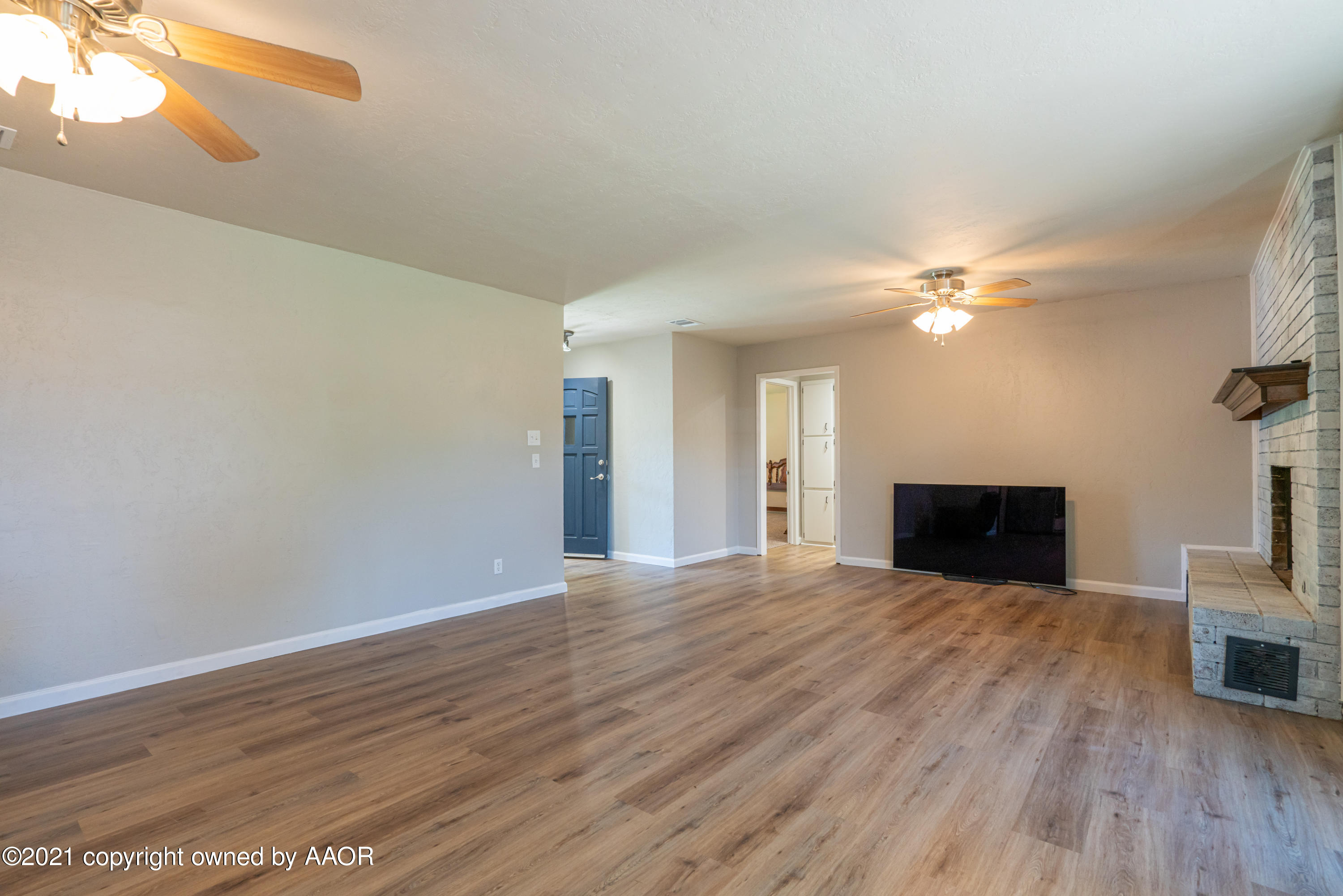 5308 Hillside Road Amarillo, TX 79109 - Photo 5 of 23 a view of empty room with wooden floor