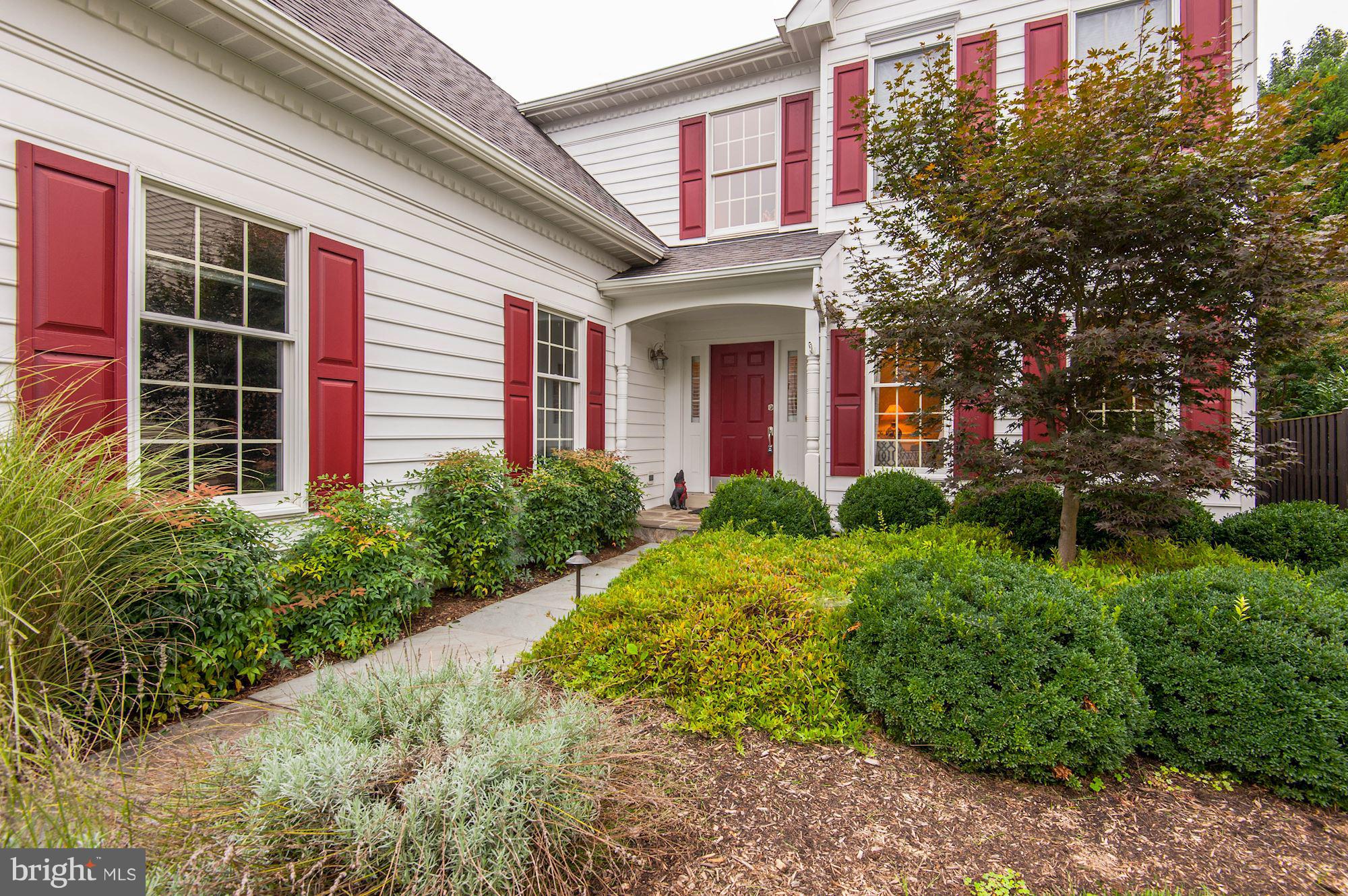 1328 Murray Downs Way Reston, VA 20194 - Photo 2 of 30 a view of a brick house with a yard