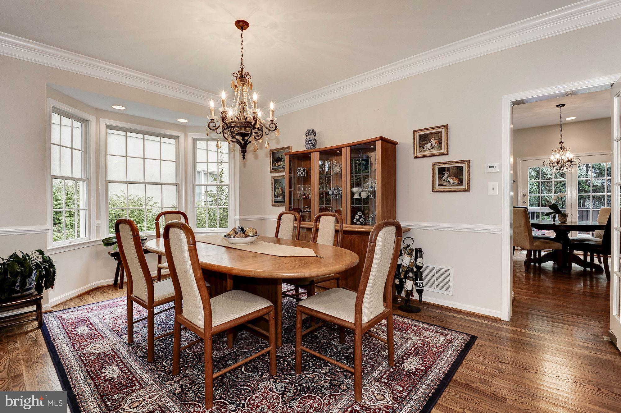 1328 Murray Downs Way Reston, VA 20194 - Photo 11 of 30 a dining room with furniture window and wooden floor