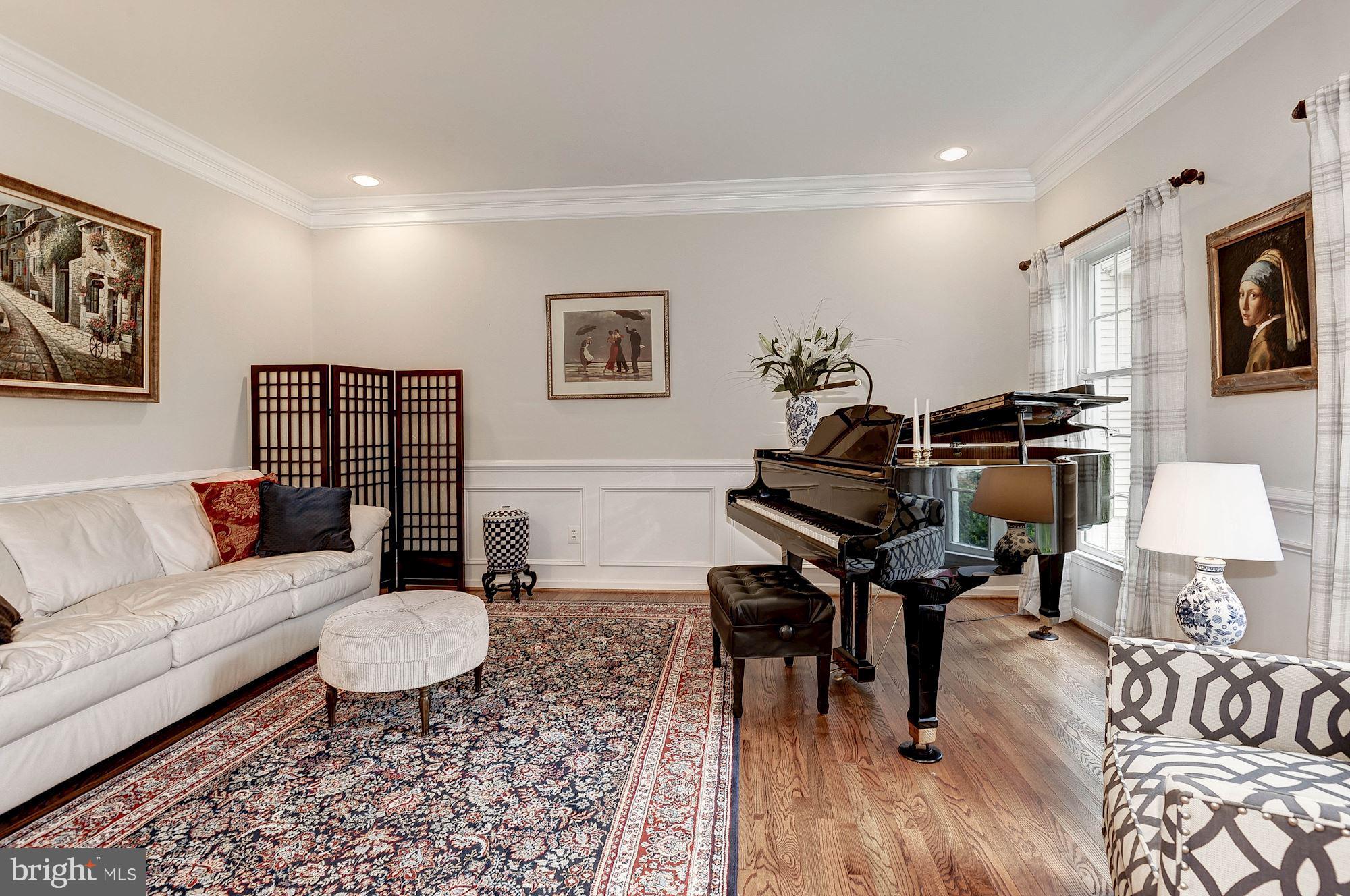 1328 Murray Downs Way Reston, VA 20194 - Photo 13 of 30 a living room with furniture a rug and a piano