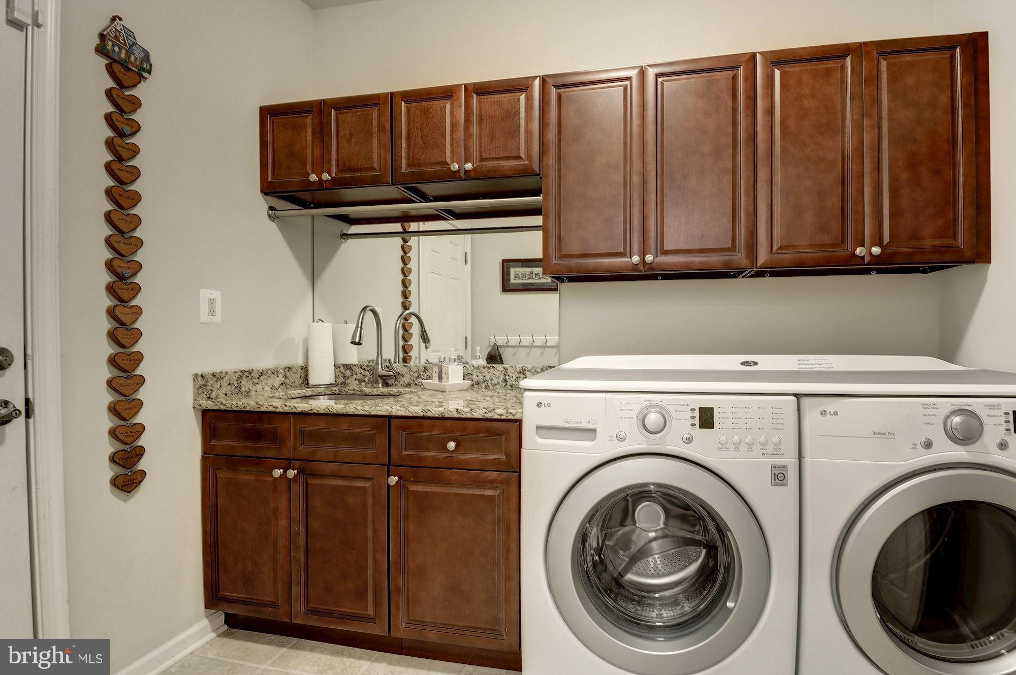 1328 Murray Downs Way Reston, VA 20194 - Photo 15 of 30 a kitchen with a sink a stove and cabinets