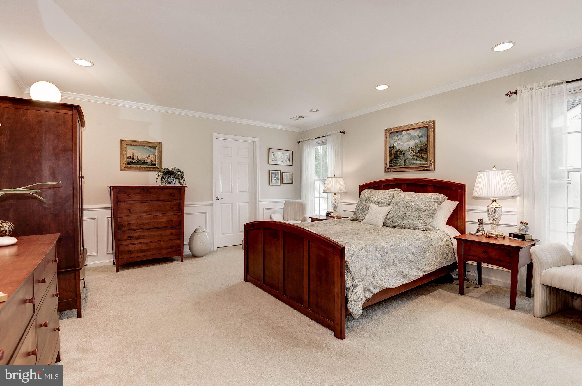 1328 Murray Downs Way Reston, VA 20194 - Photo 16 of 30 a bedroom with a bed and furniture
