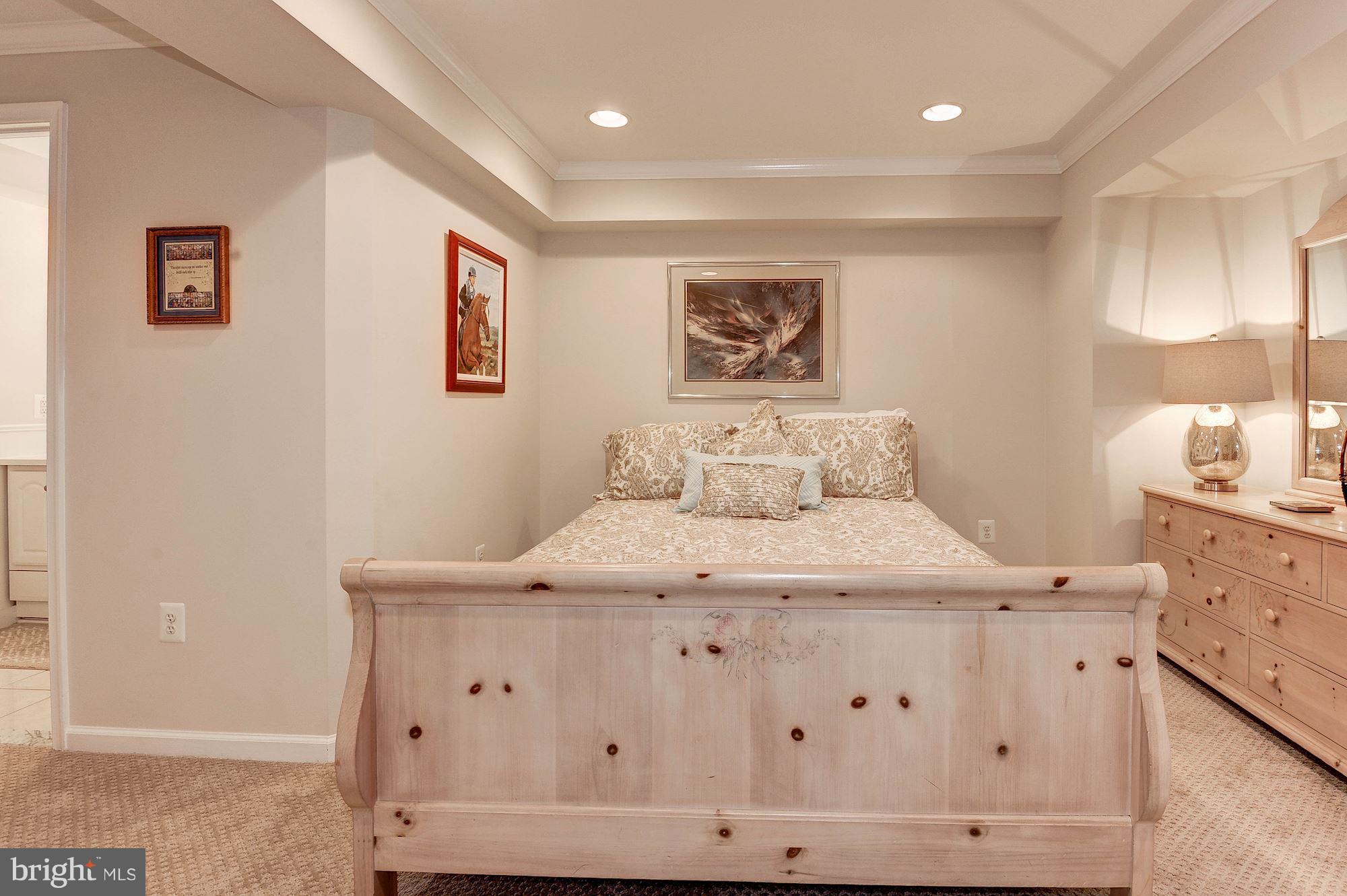 1328 Murray Downs Way Reston, VA 20194 - Photo 25 of 30 a bedroom with a bed and a painting on the wall