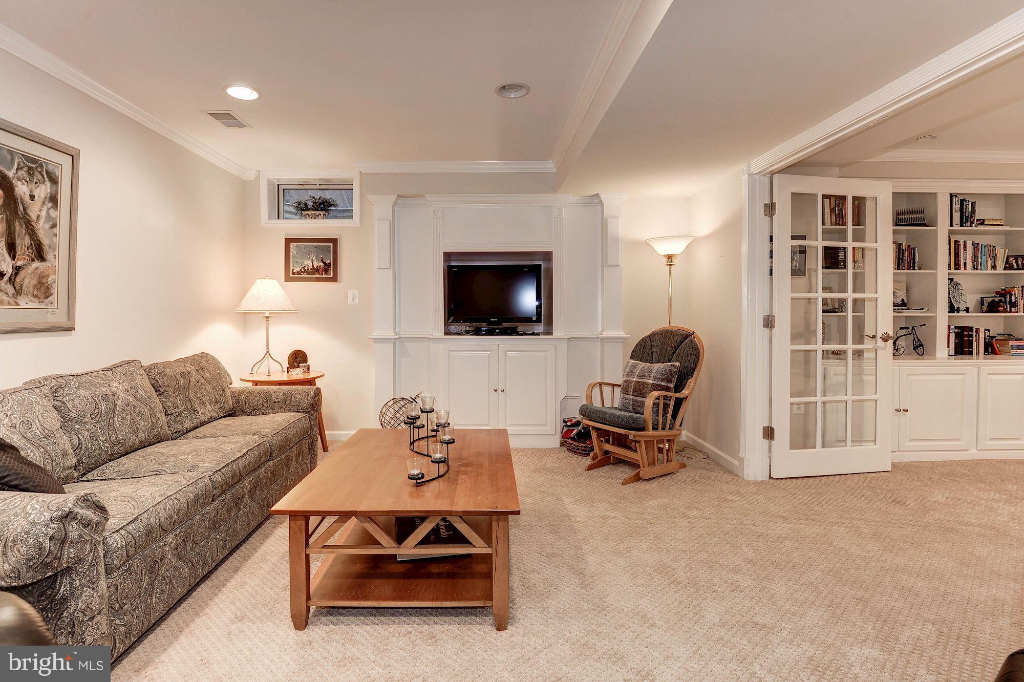 1328 Murray Downs Way Reston, VA 20194 - Photo 26 of 30 a living room with furniture window and a flat screen tv