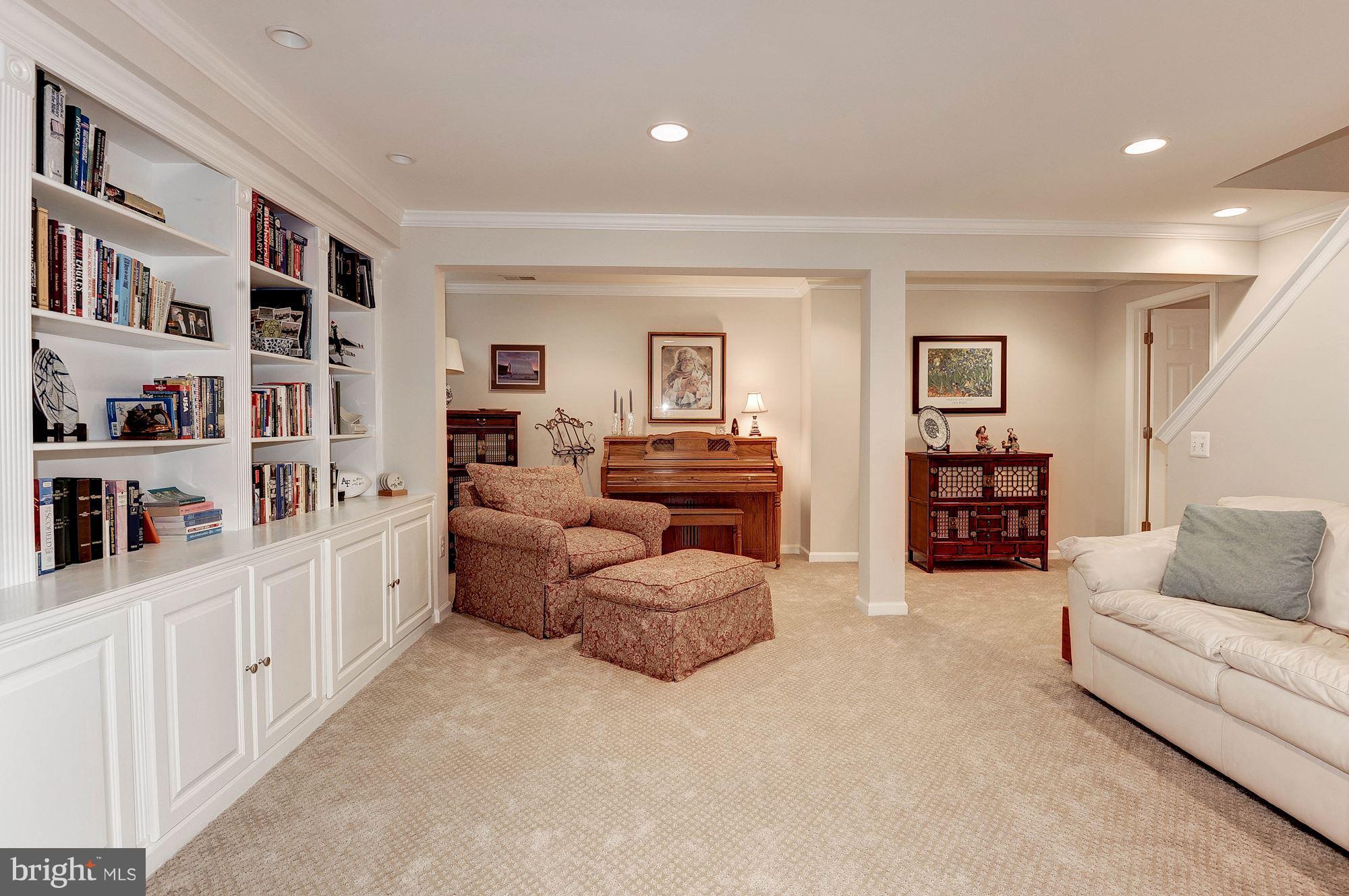 1328 Murray Downs Way Reston, VA 20194 - Photo 27 of 30 a living room with furniture and a large bed