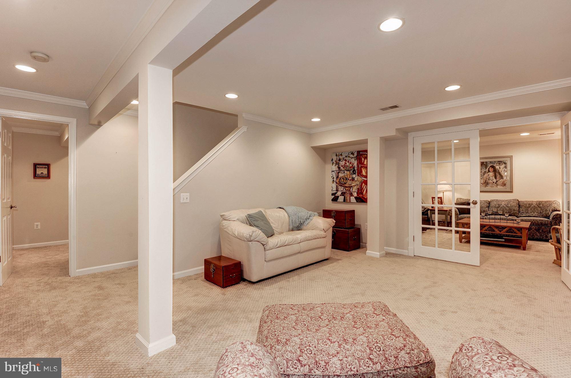 1328 Murray Downs Way Reston, VA 20194 - Photo 28 of 30 a living room with furniture and a couch