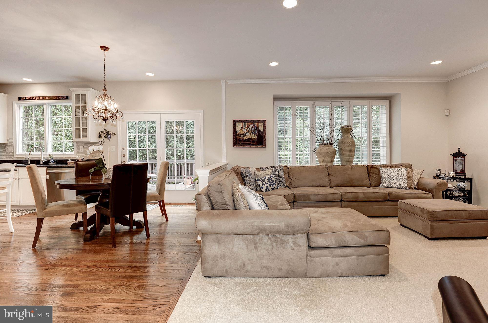 1328 Murray Downs Way Reston, VA 20194 - Photo 6 of 30 a living room with furniture dining table and a large window