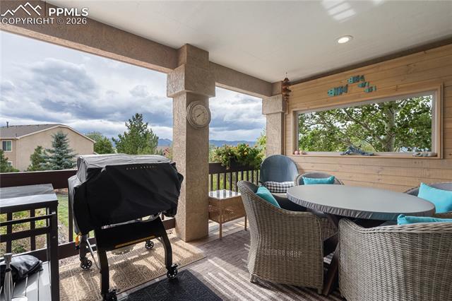 15110 Ridgefield Lane Colorado Springs, CO 80921 - Photo 37 of 50 Enclosed and covered 10 x 14 deck with mountain views