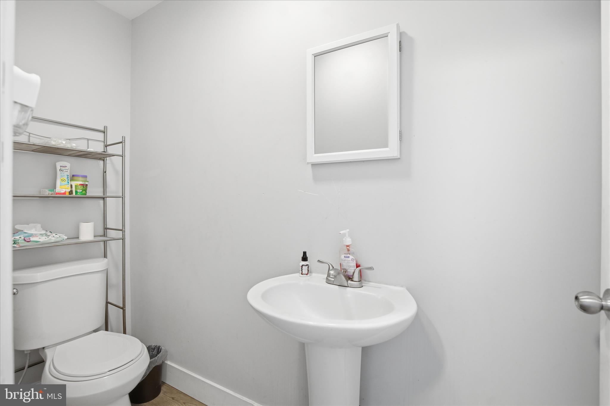 254 South 8th Street Lebanon, PA 17042 - Photo 14 of 25 a bathroom with a sink a toilet and mirror