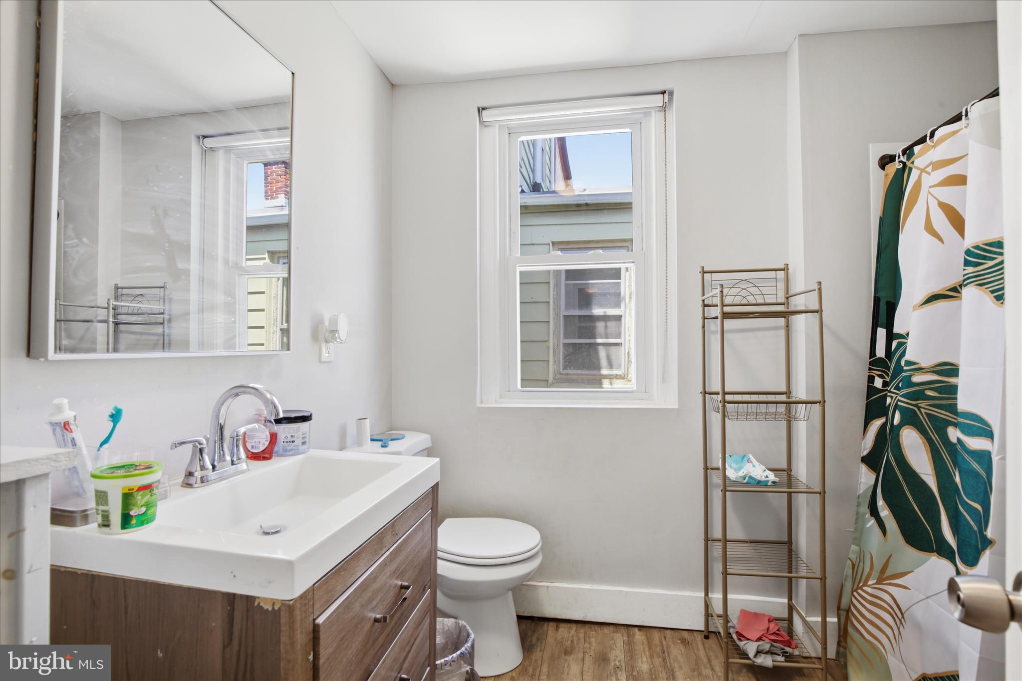 254 South 8th Street Lebanon, PA 17042 - Photo 15 of 25 a bathroom with a sink toilet and a mirror