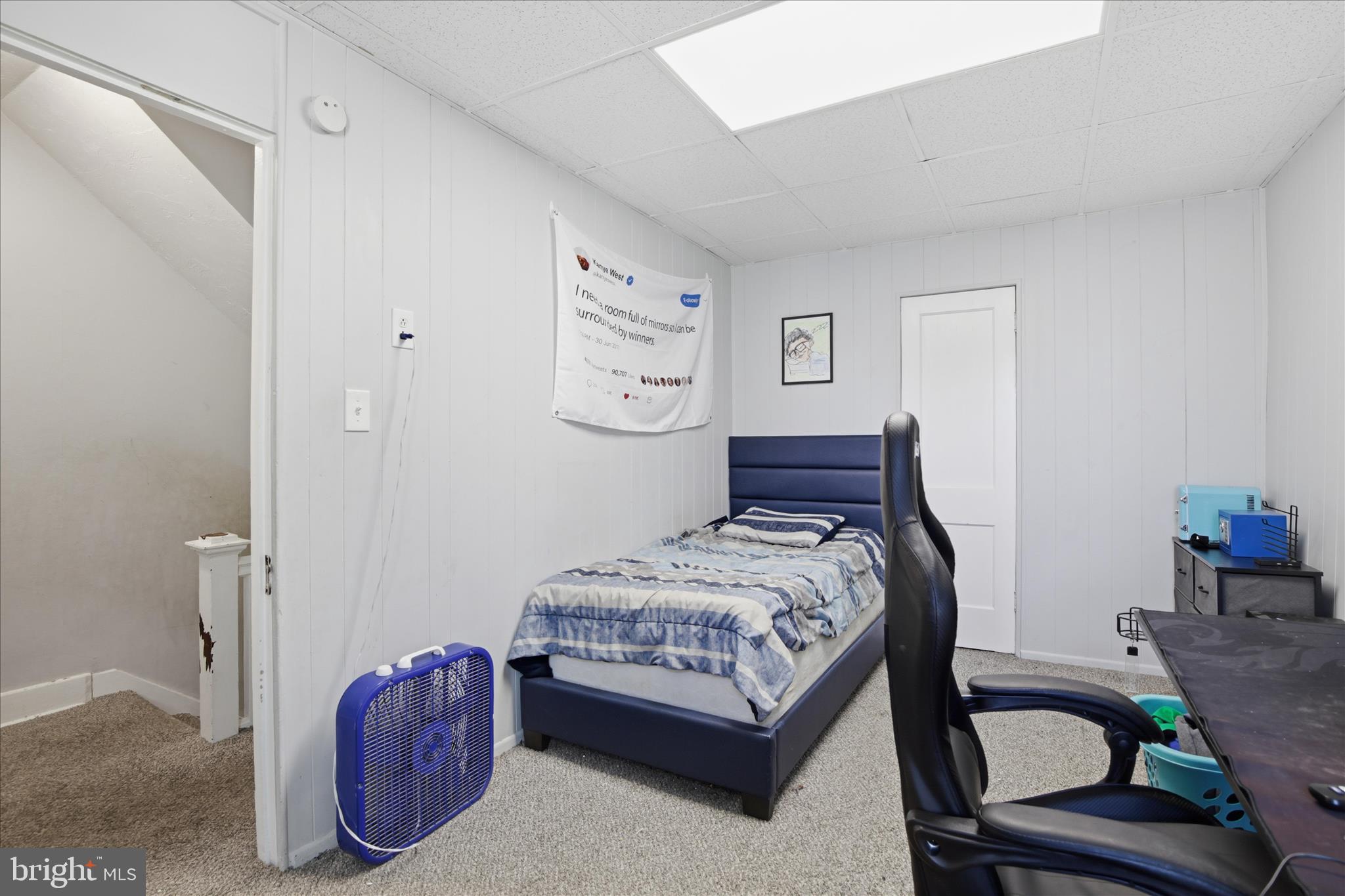 254 South 8th Street Lebanon, PA 17042 - Photo 18 of 25 a bedroom with a bed a chair and painting on the wall