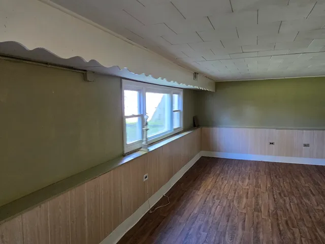 a view of an empty room and window
