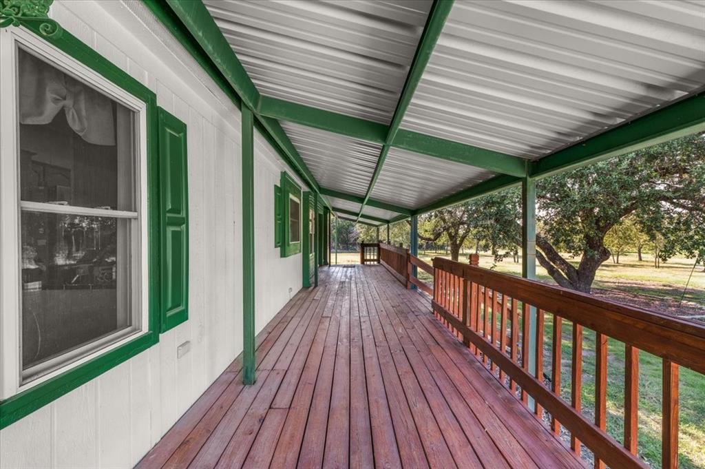 1849 Floyd Road Weatherford, TX 76087 - Photo 12 of 40 a view of a balcony with wooden floor