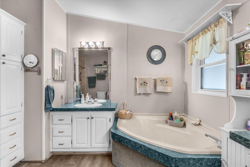 1849 Floyd Road Weatherford, TX 76087 - Photo 28 of 40 a bathroom with a granite countertop sink mirror and vanity