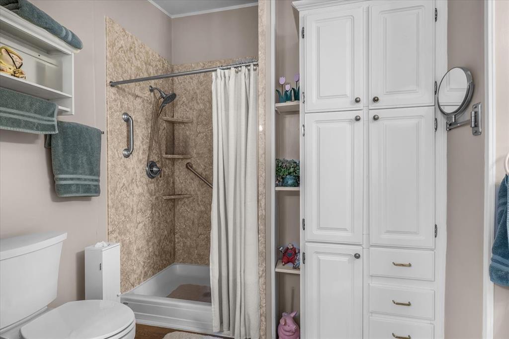 1849 Floyd Road Weatherford, TX 76087 - Photo 29 of 40 a bathroom with a shower toilet and sink