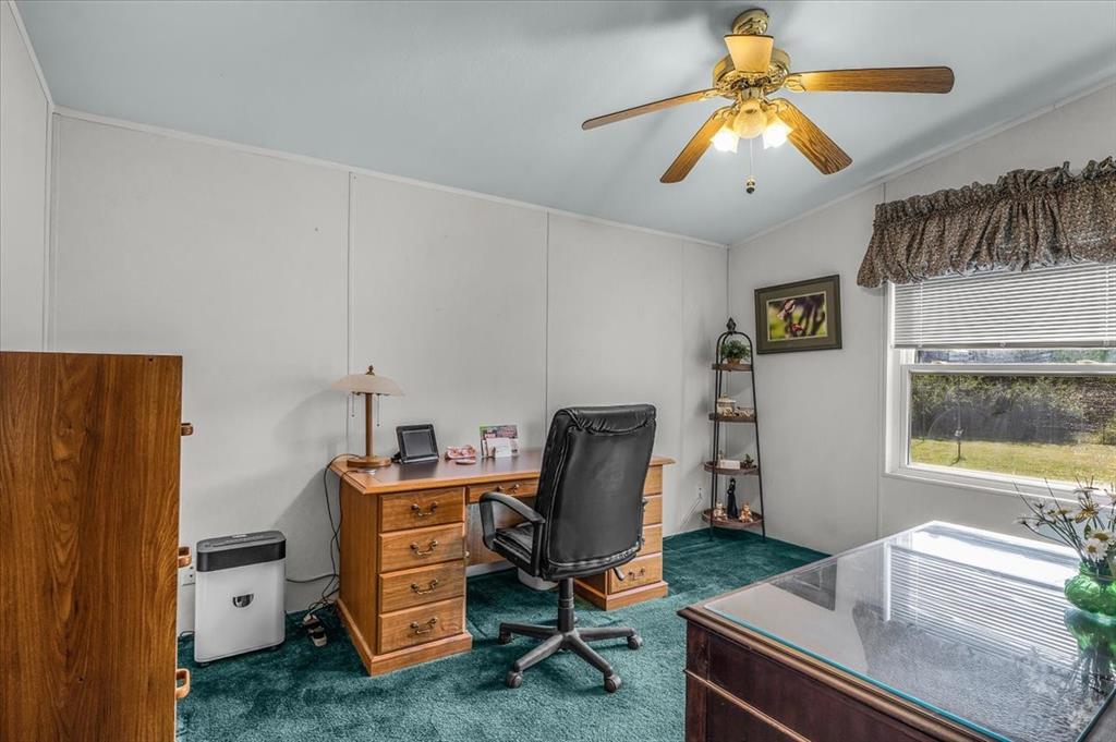 1849 Floyd Road Weatherford, TX 76087 - Photo 30 of 40 a view of a workspace with furniture and a window