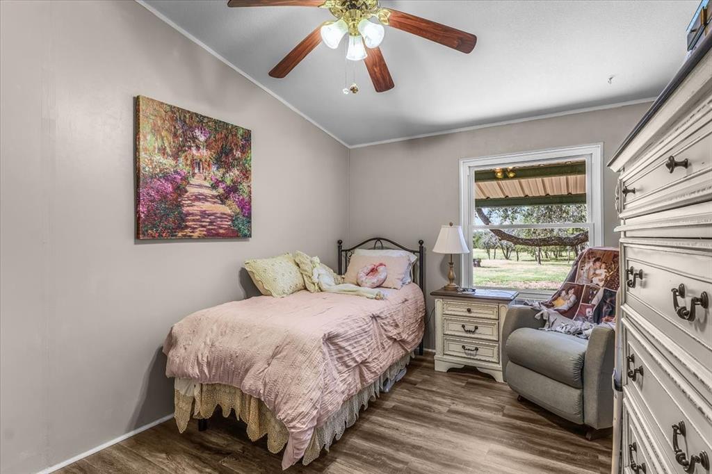 1849 Floyd Road Weatherford, TX 76087 - Photo 32 of 40 a bedroom with a bed and a couch