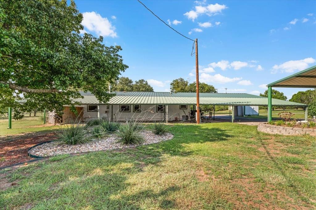 1849 Floyd Road Weatherford, TX 76087 - Photo 34 of 40 a view of a big yard with plants and large trees