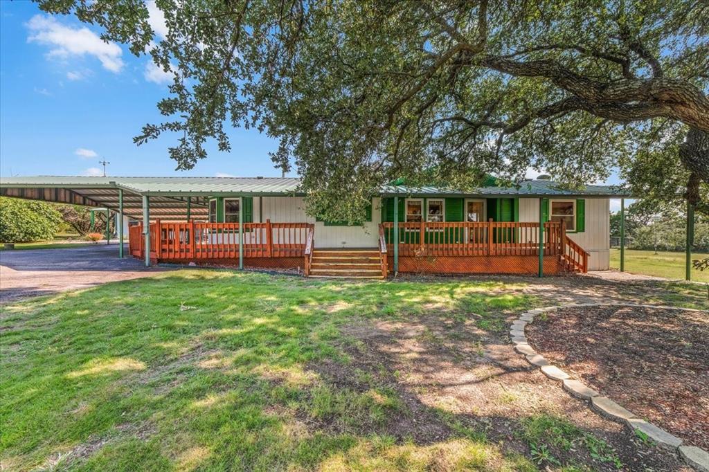 1849 Floyd Road Weatherford, TX 76087 - Photo 5 of 40 a view of a house with backyard and a tree