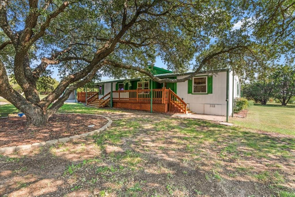 1849 Floyd Road Weatherford, TX 76087 - Photo 6 of 40 a backyard of a house with wooden floor and fence