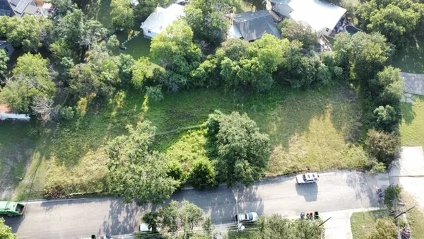 an aerial view of residential house with outdoor space and lake view