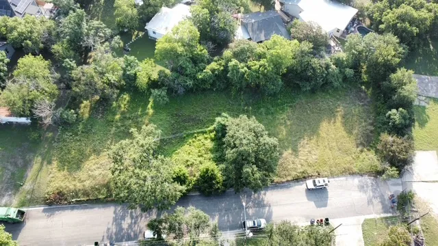 an aerial view of residential house with outdoor space and lake view
