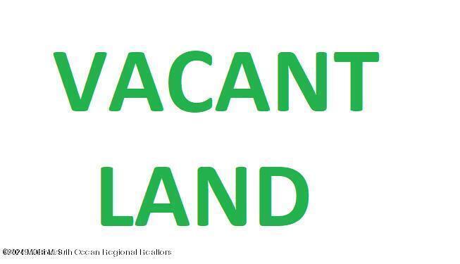 957 East County Line Road Lakewood, NJ 08701 - Photo 1 of 1 a view of a wooden floor with a white wall