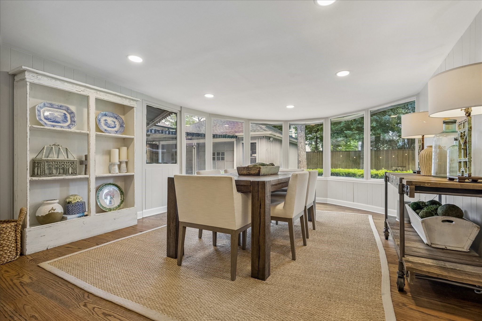 1018 Ben Hur Drive Spring Valley Village, TX 77055 - Photo 7 of 30 The spacious dining room features recessed lighting and expansive windows overlooking the lush backyard.