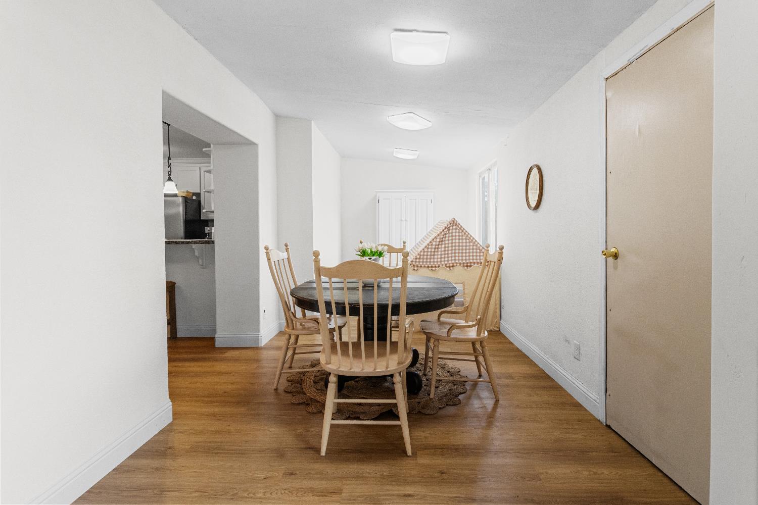 3319 U Street Antelope, CA 95843 - Photo 7 of 14 a view of a dining room with furniture and wooden floor