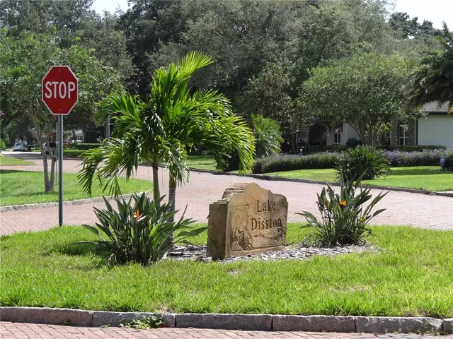 a kitchen with stainless steel appliances granite countertop a refrigerator a stove a sink and a microwave