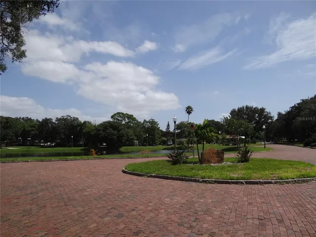 a view of an empty room with a fireplace