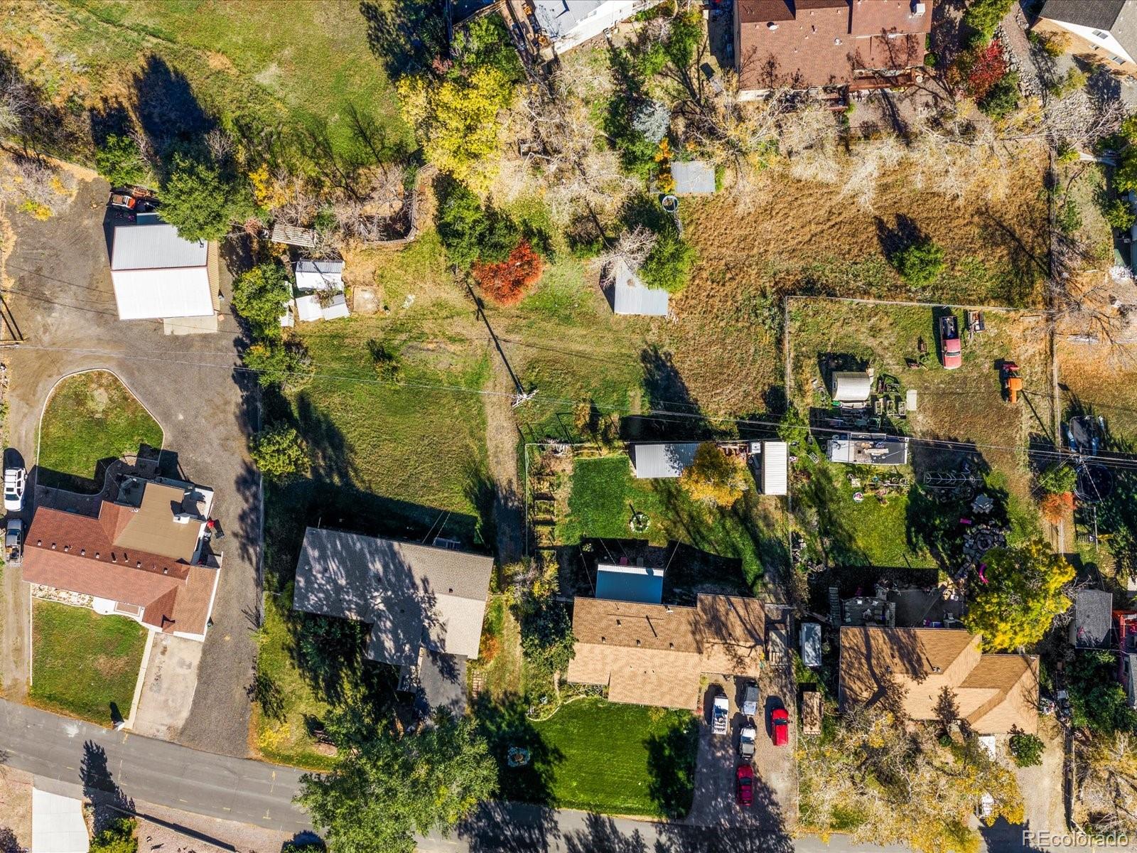 9815 West 37th Avenue Wheat Ridge, CO 80033 - Photo 47 of 50 an aerial view of a houses with yard