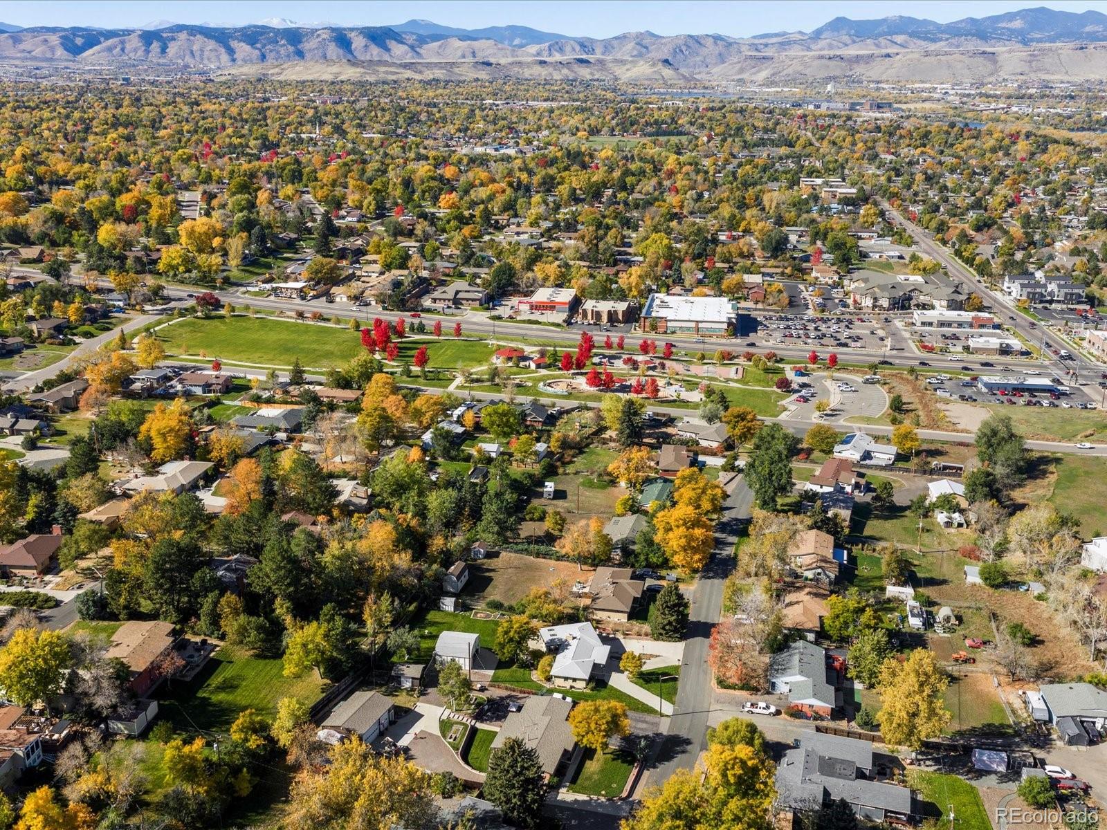 9815 West 37th Avenue Wheat Ridge, CO 80033 - Photo 50 of 50 an aerial view of residential house with parking and trees