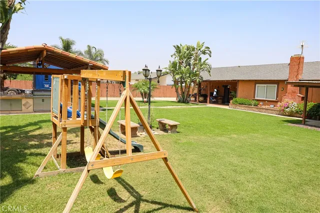 a patio with a yard table and chairs