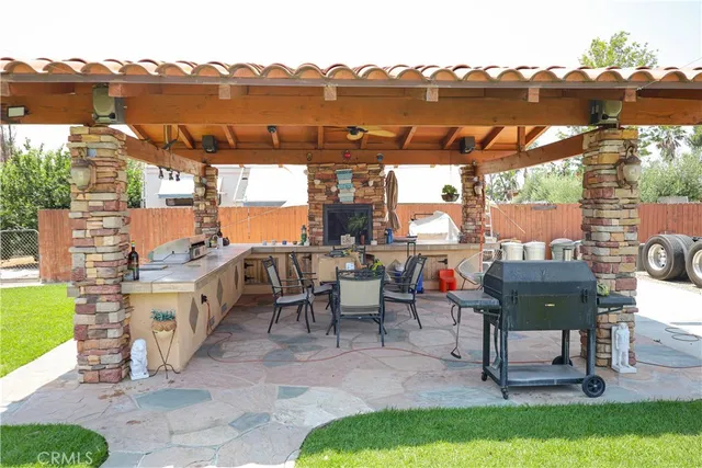 a view of a terrace with furniture and a lake view