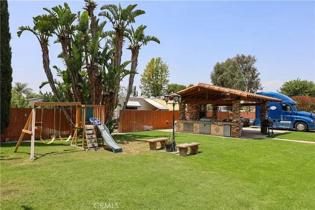 a view of a terrace with furniture and a lake view