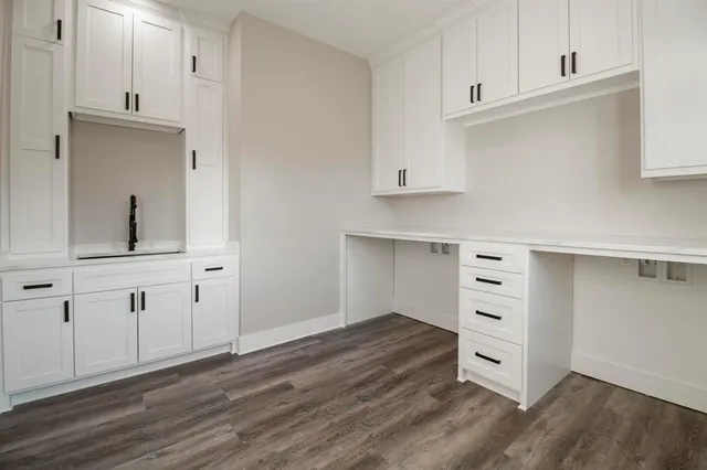 a view of cabinets and wooden floor