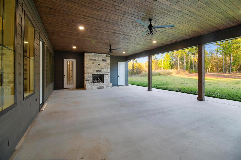 800 Stone Chimney Road Bullard, TX 75757 - Photo 36 of 40 a view of an empty room with a fireplace and a large window