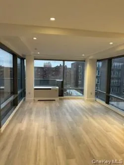 a view of an empty room with a fireplace