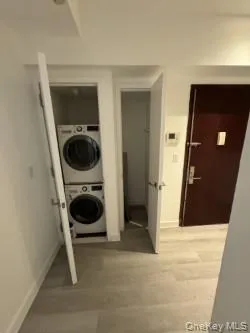 a view of a hallway with washer and dryer