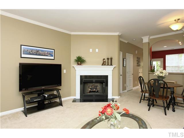7818 Silverthread Lane Raleigh, NC 27617 - Photo 19 of 19 Open floor plan is perfect for furniture placement. LR includes crown molding, ceiling fan, gas fireplace with highly upgraded granite surround and neutral plush carpet.