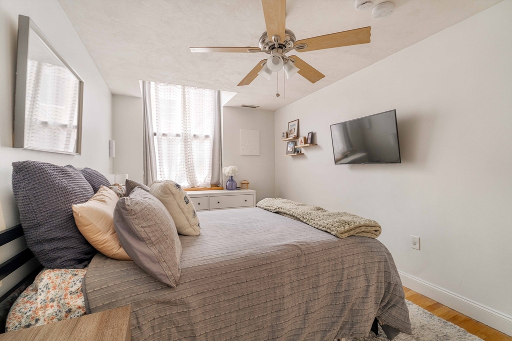188 North Street, Unit 22 Boston, MA 02113 - Photo 11 of 18 a bedroom with a bed and window