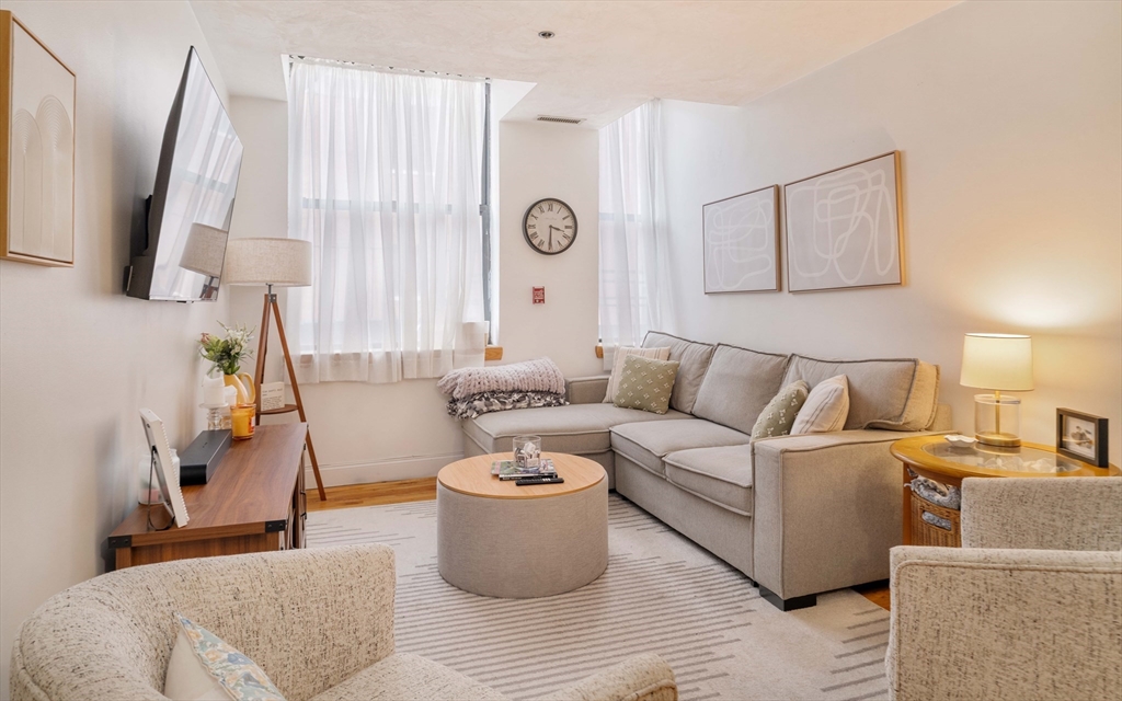 188 North Street, Unit 22 Boston, MA 02113 - Photo 4 of 18 a living room with furniture and a large window