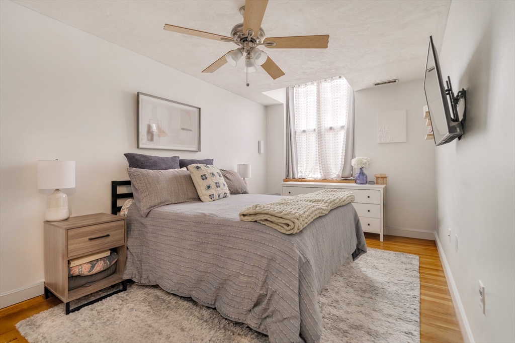 188 North Street, Unit 22 Boston, MA 02113 - Photo 10 of 18 a bedroom with a bed dresser and a window